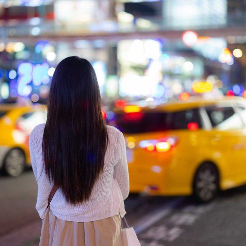 woman waiting on a taxi